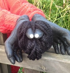 Let's Play Music - Incy Wincy Spider Puppet made out of a ball of wool, two buttons and a pair of old gloves!